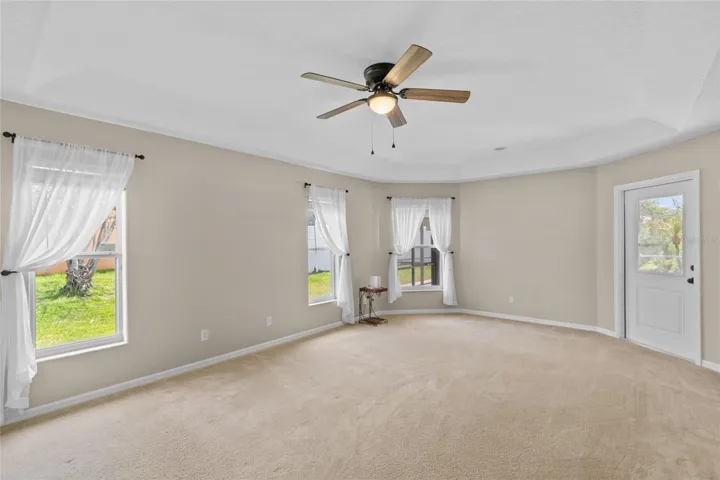 Primary Bedroom w backdoor to pool