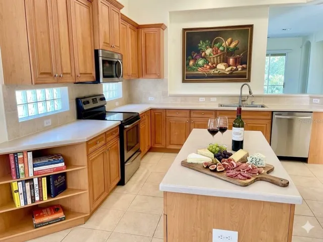 kitchen with lots of cabinets and a large pantry that is not shown- staged