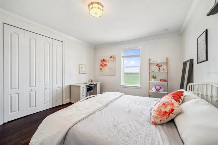 One of 3 bedrooms on the 3rd floor with backyard water view.