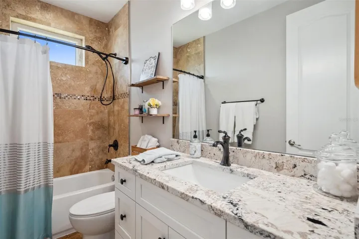 The 3rd floor bathroom with tub/shower combo is shared between two of the three bedrooms on this level.