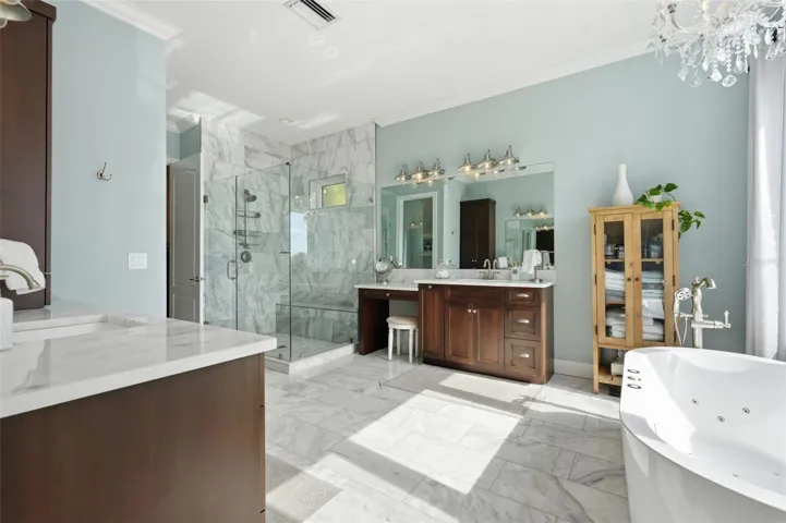 A spacious master bathroom retreat with real marble on the floors, the countertops and the shower walls. Nice, right?