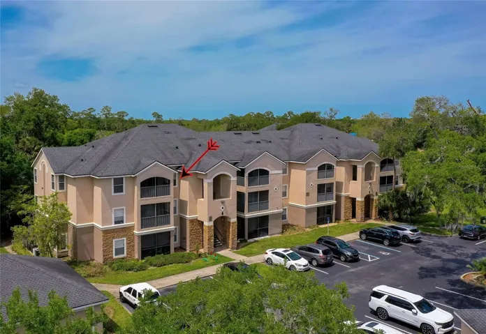 Attractive community setting with mature landscaping and ample parking for residents and guests.