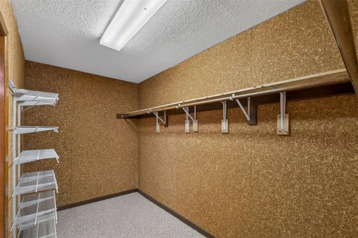 Oversized walk-in closet offering abundant storage space.