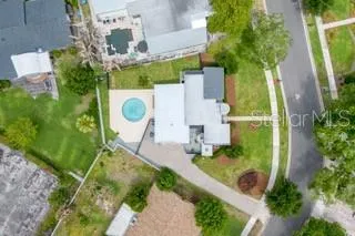 Aerial view highlighting the home’s spacious lot, private pool, and desirable position on quiet Mallard Circle.