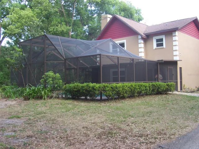 Exterior Front Showing Caged Inground Pool