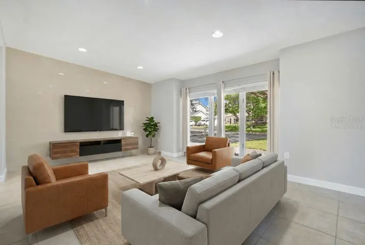 Virtually staged to showcase layout of Family Room.