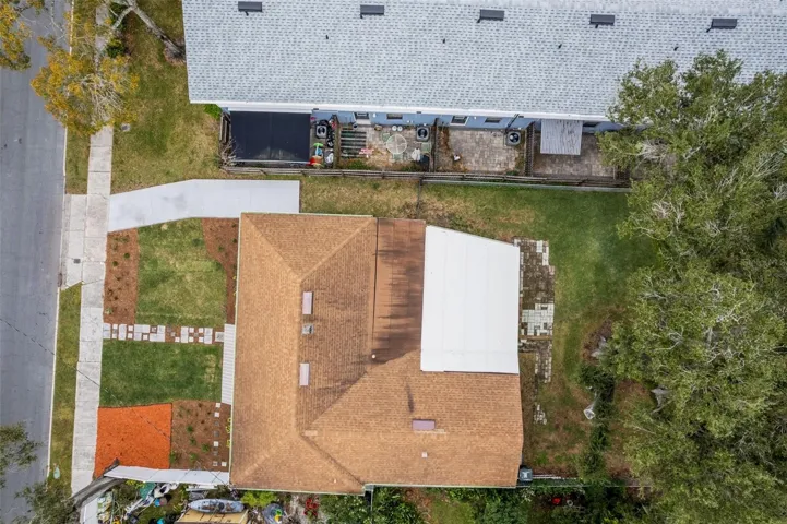 The long driveway provides space to park two vehicles and the mulched area to the other side of the lot is perfect for short-term guest parking.