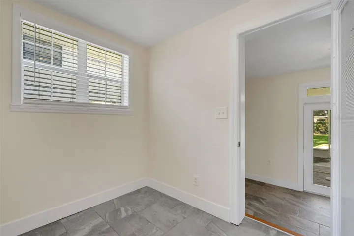 Directly adjacent to the kitchen is the casual dining nook that leads to the Florida Room