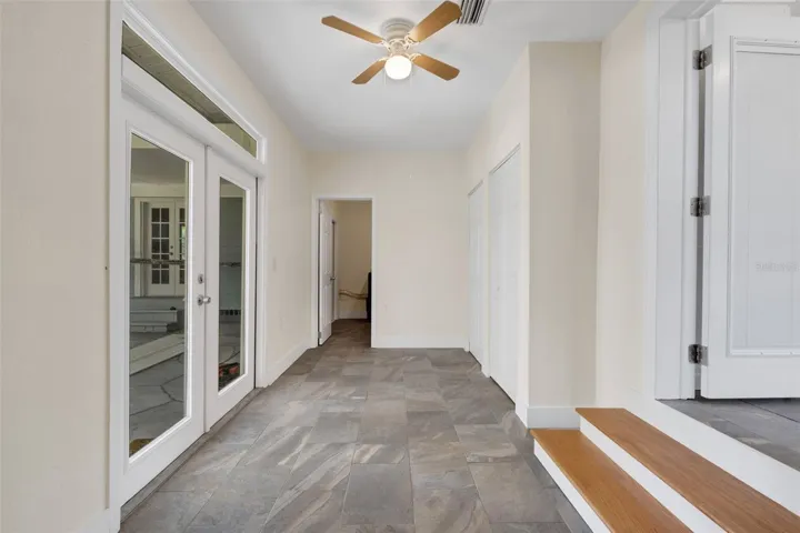Florida Room offers additional closet storage options and direct access to the covered patio/lanai in back of the home.