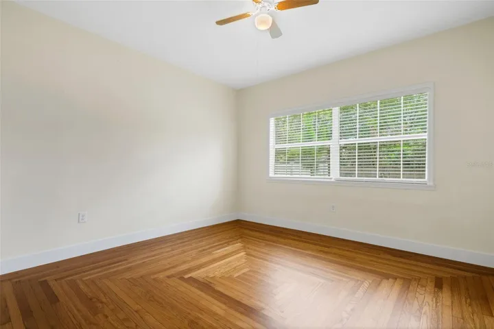 Bedroom #2 is a repeat of the same wood flooring pattern . . .