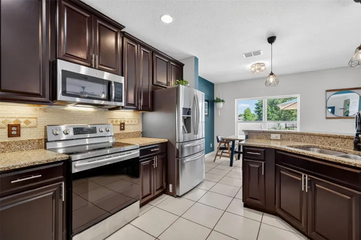 Kitchen with 40-inch cabinetry and granite countertops