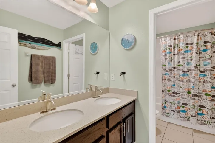 Upstairs full, split bathroom with dual sinks