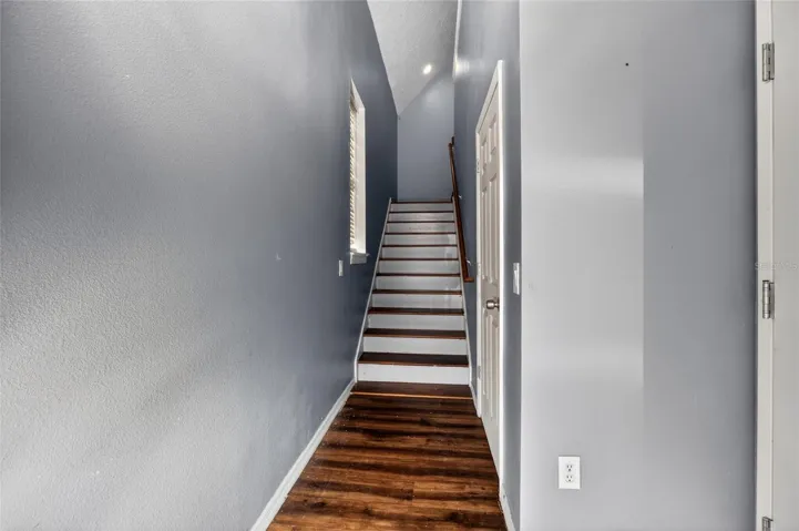 Staircase of the Rear Home with Coat Closet