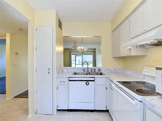 kitchen with dishwasher, range, and refrigerator