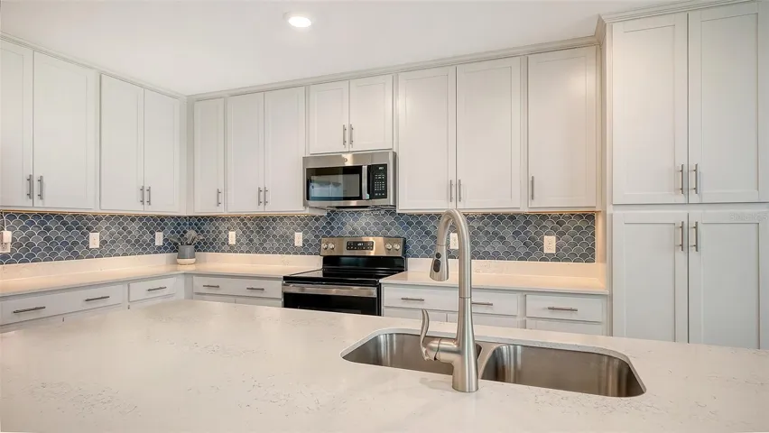 Gleaming backsplash with under cabinet lighting