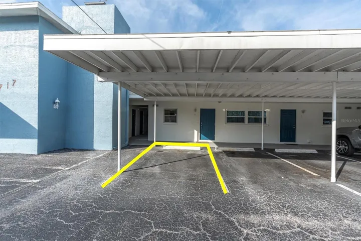Front of condo with parking spot