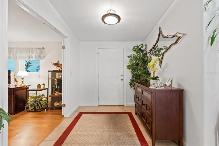 Foyer opens to den/office