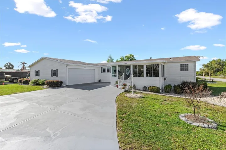 1,848 sq ft 3-bedroom, 2 bath home plus a 20 x 12 ft enclosed lanai and a huge 36 ft x 22 ft garage.