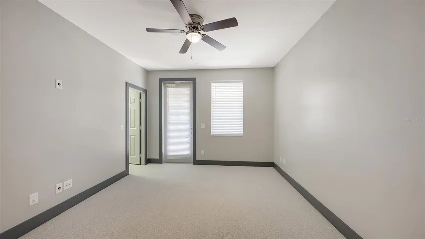 The first-floor primary has a private balcony.