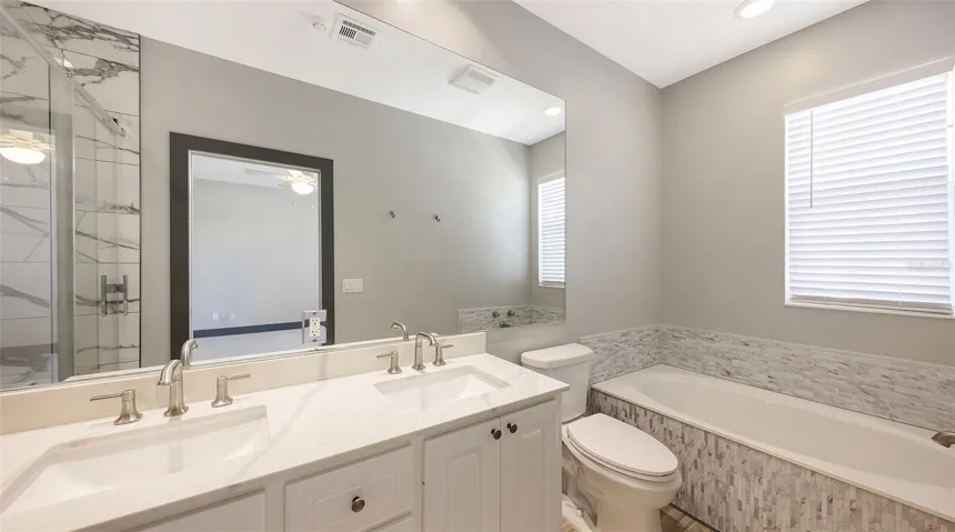 Soaking tub completes the bath.