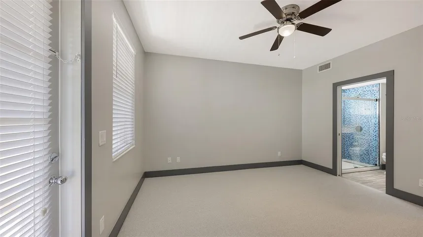The first-floor primary has access to the first-floor bath.