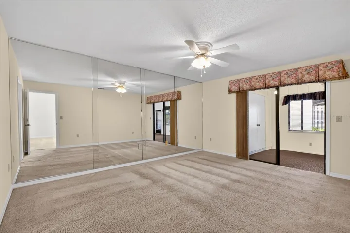 Primary Bedroom opens to air conditioned Florida Room