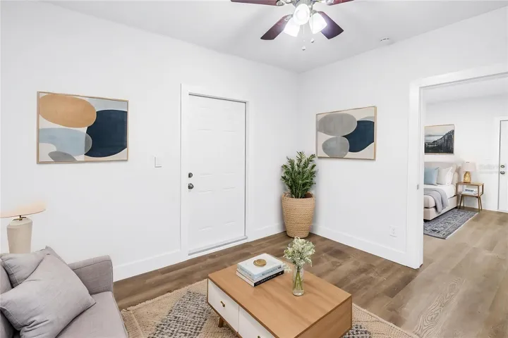 Virtually staged back unit 2 bedroom living room.