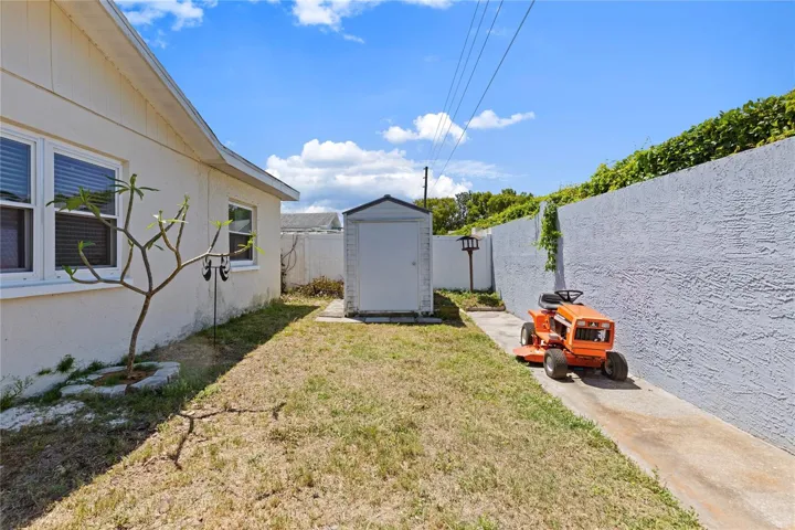 Back Yard with 8 foot concrete privacy fence on back of property