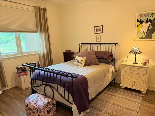 Primary Bedroom With Views Of The Pond And Fountain