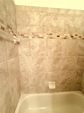 Full Tiled Tub In The Guest Bathroom
