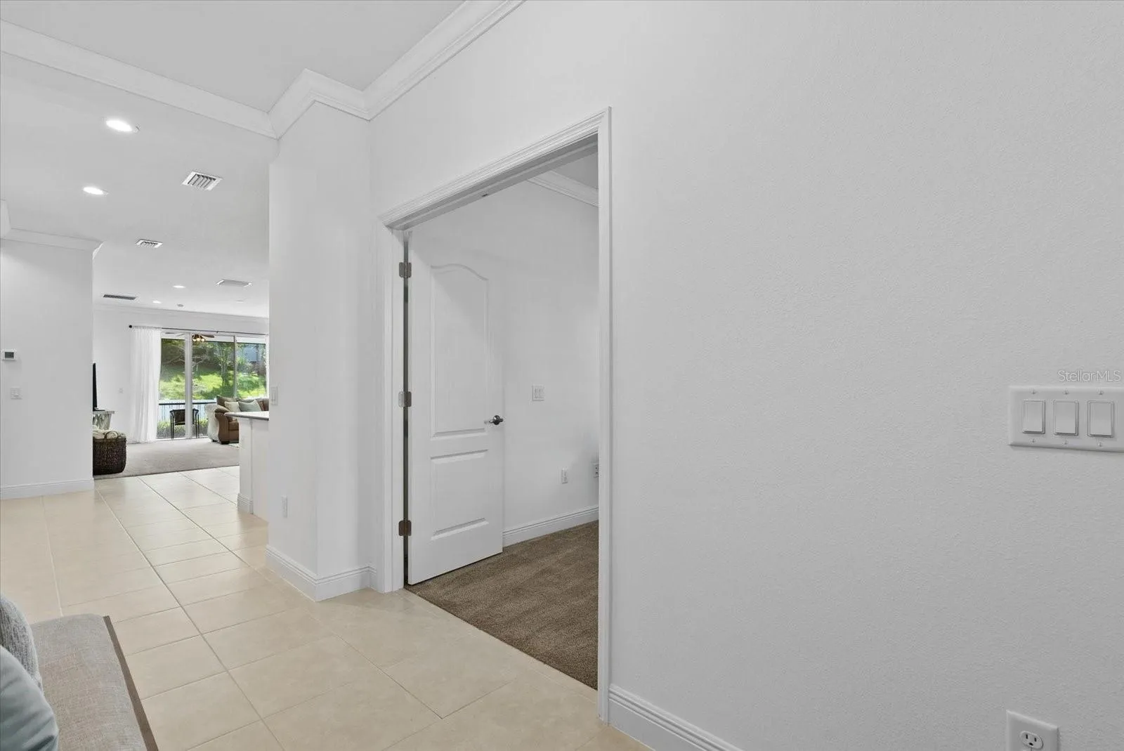 Foyer/hallway creates spaces from main living area