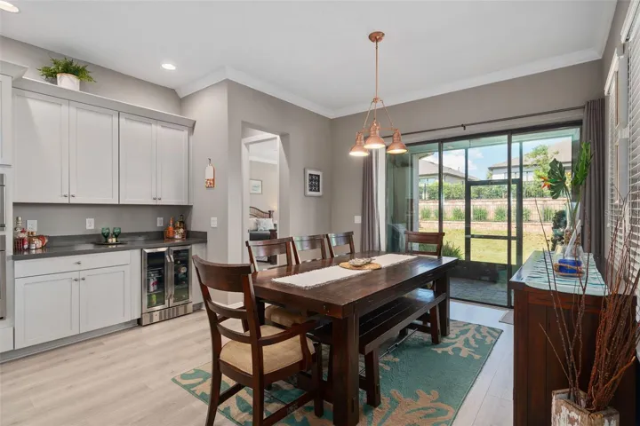 Dining Area with a View of the Lanai and Rear Yard