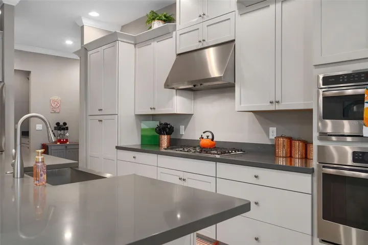 Gourmet Kitchen with Upgraded Cabinetry. The Hood is vented to the outside.