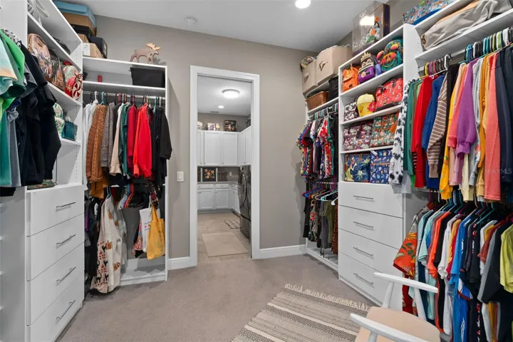 Primary Suite Custom Closet. This is adjacent to the Laundry Room for your convenience.
