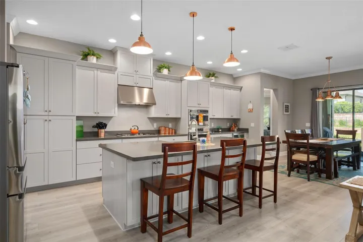 Gorgeous Gourmet Kitchen with all of those Cabinets and built-in Stainless Appliances. There are Cabinets on the front of the Island also.