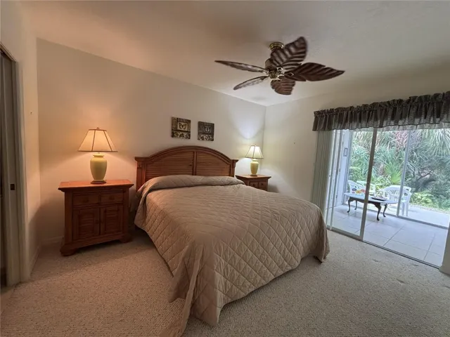 #1 Bedroom with slider to sunroom & laundry closet