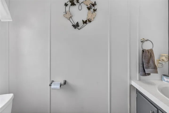 Half bathroom connected to the laundry room