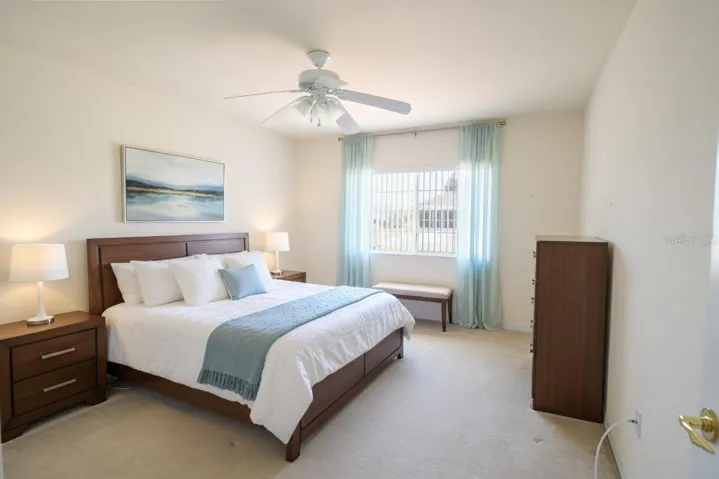 Staged Carpeted Guest Bedroom