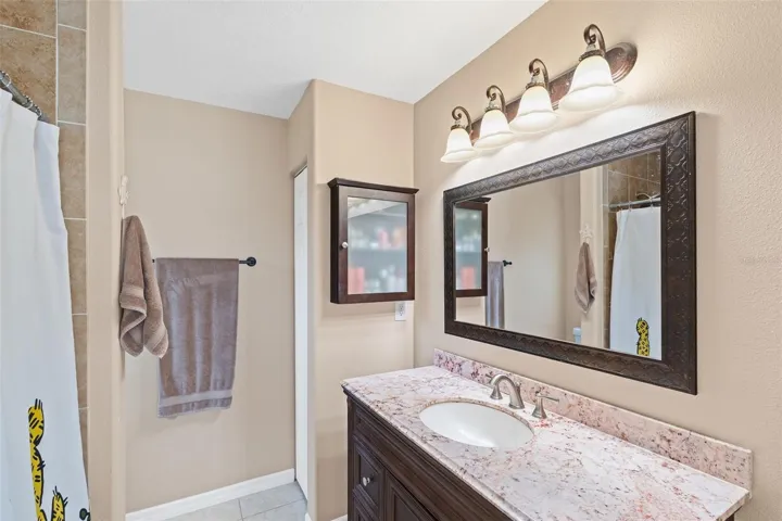 Primary bathroom with walk-in shower and linen closet