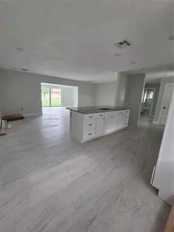 kitchen has an eating area and overlooks living space