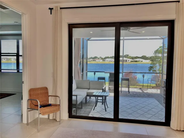 View of Lake/Extended Screened Lanai from Living Room