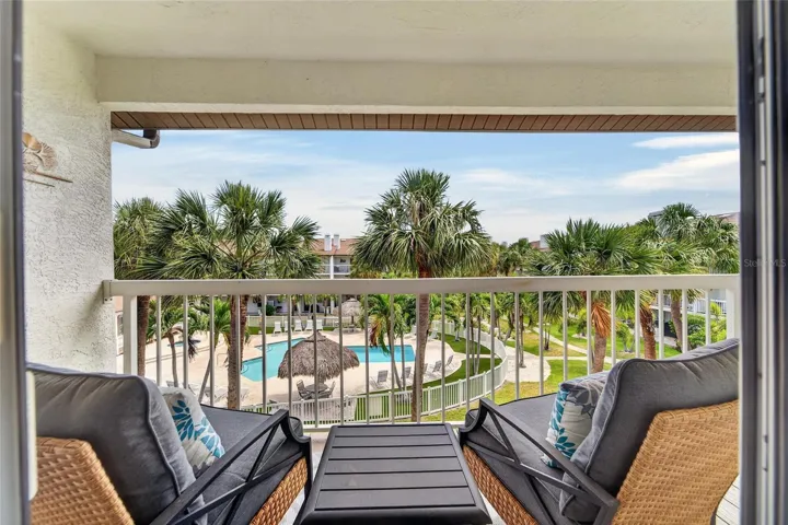 PRIMARY SUITE BALCONY WITH VIEW OF POOL