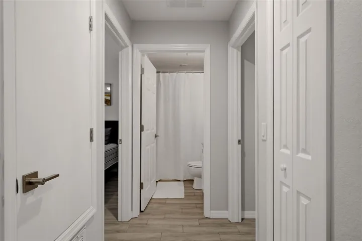 Hallway with ample storage and closet space