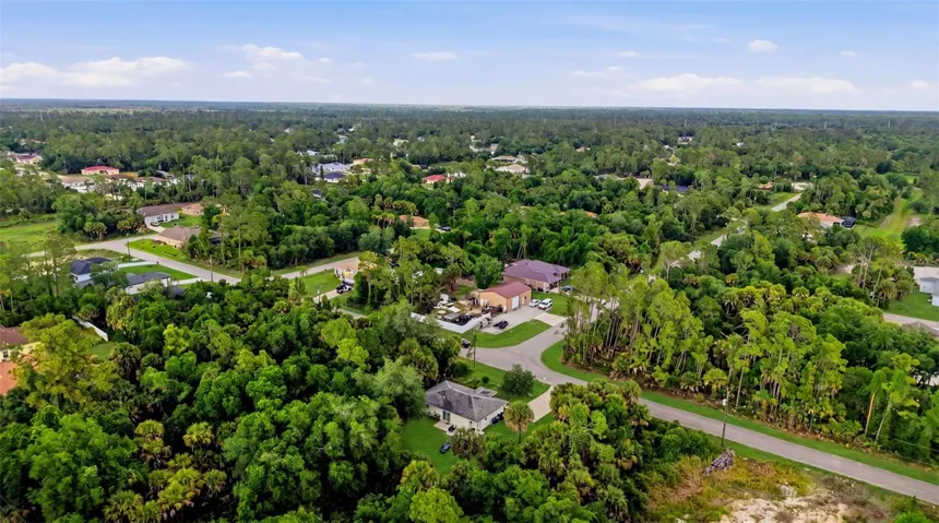 Aerial view highlighting neighborhood and lot positioning