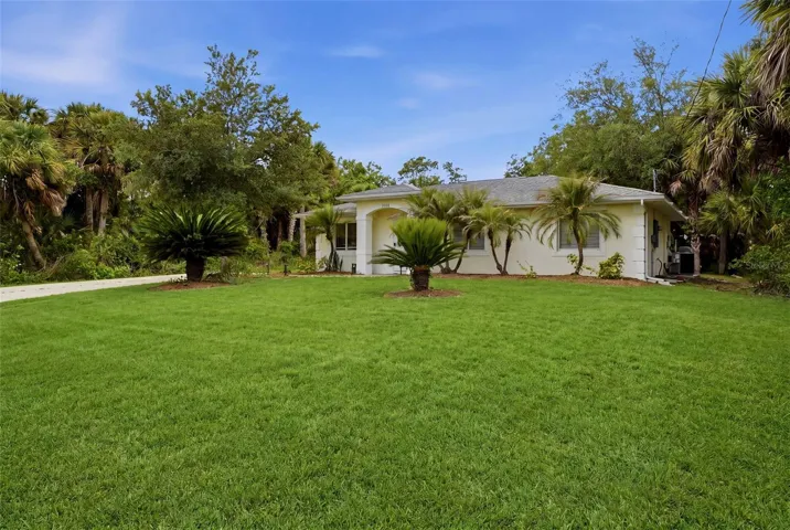 Alternate front exterior view showcasing lot size and privacy