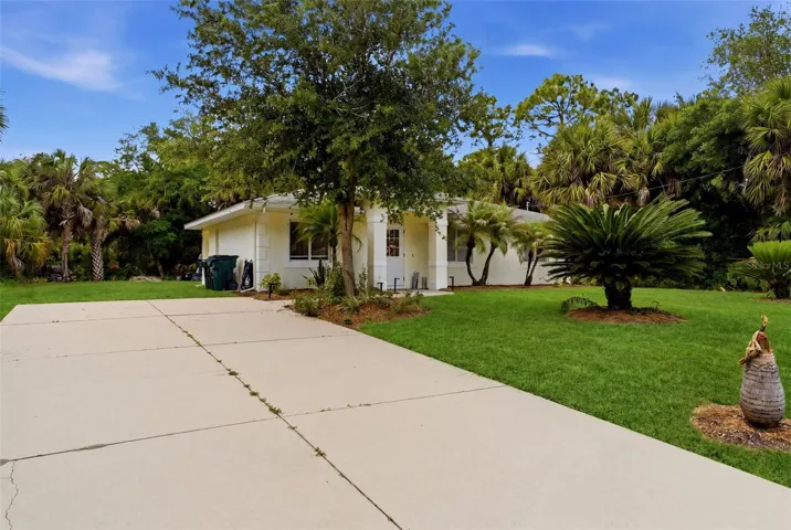 Extended driveway with ample parking and front yard space