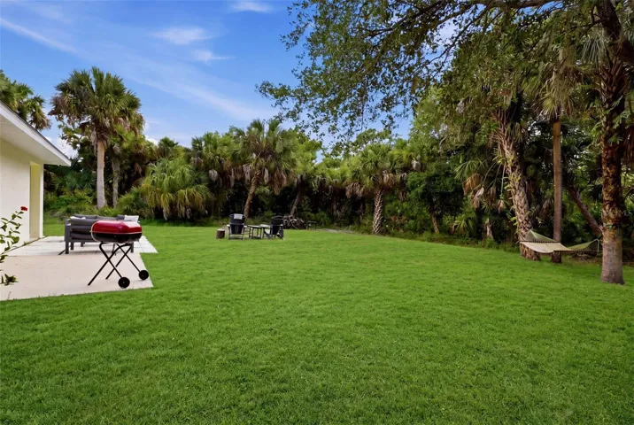 Expansive backyard with lush greenery and privacy