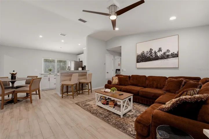 Living room with vaulted ceilings and open layout
