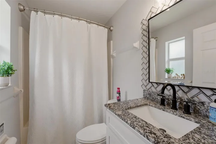 Bathroom with shower and updated vanity