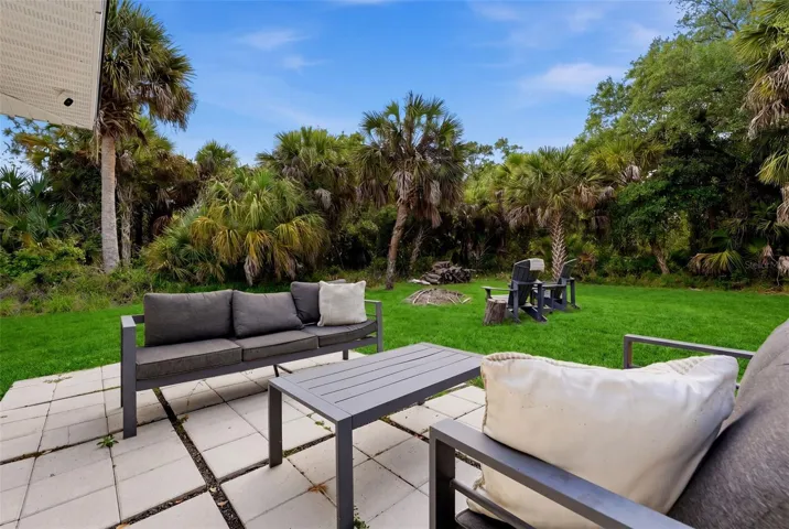 Outdoor seating area overlooking backyard